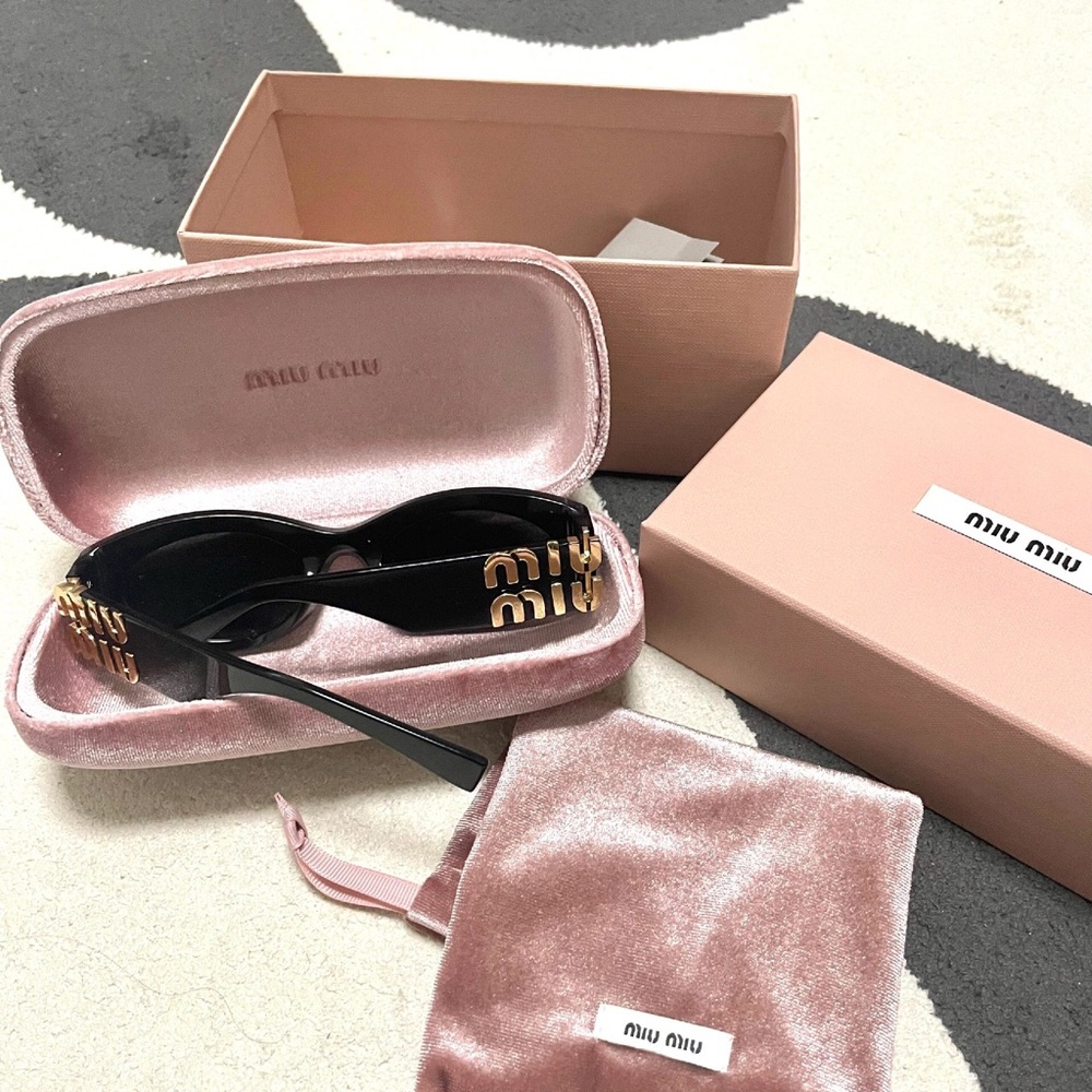 Miu Miu Black Sunglasses with Gold Detailing